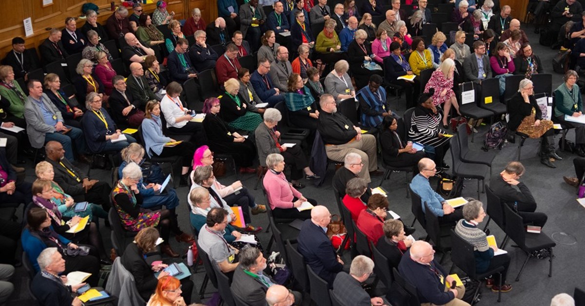 Diverse church congregation gathering together in worship and community